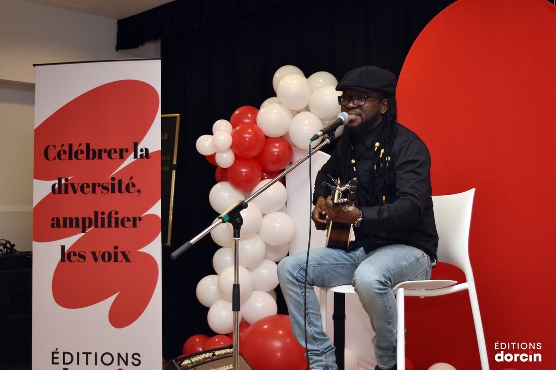 A musician playing guitar during the evening